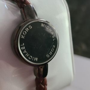 Michael Kors Access activity fitness tracker watch. Brown braided leather band.